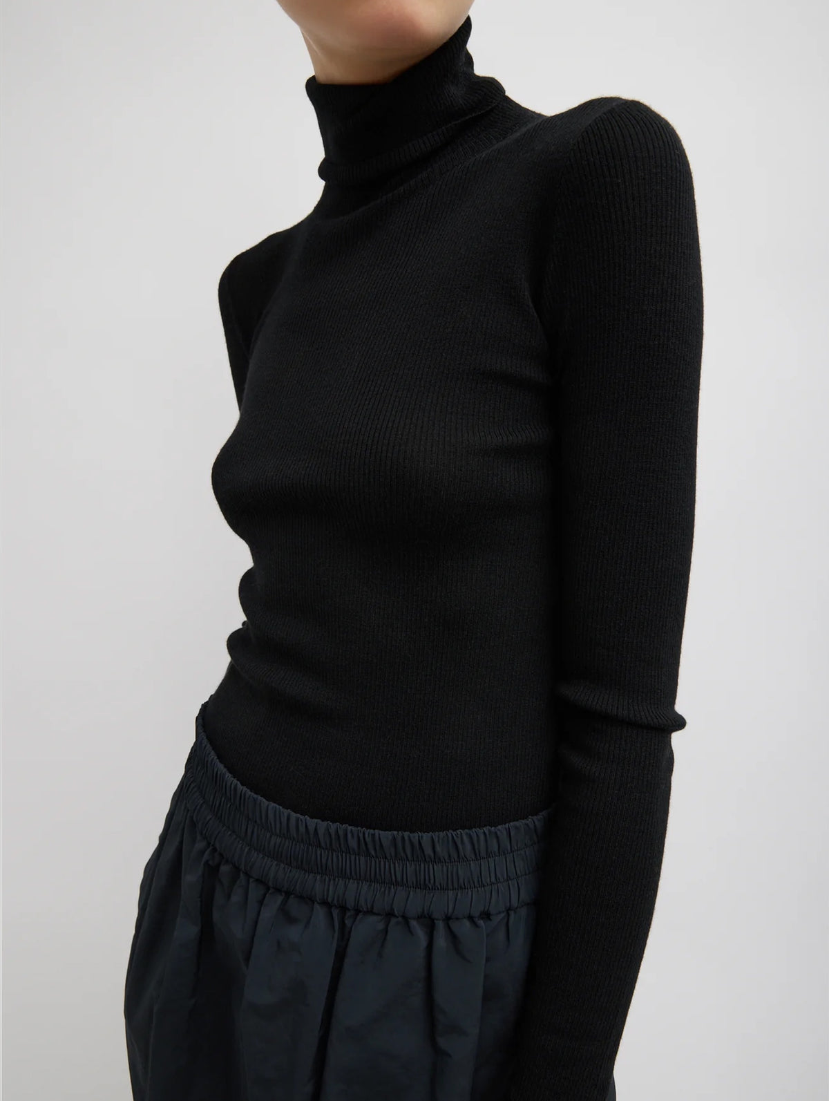 Feather Weight Ribbed Turtleneck Sweater in Black